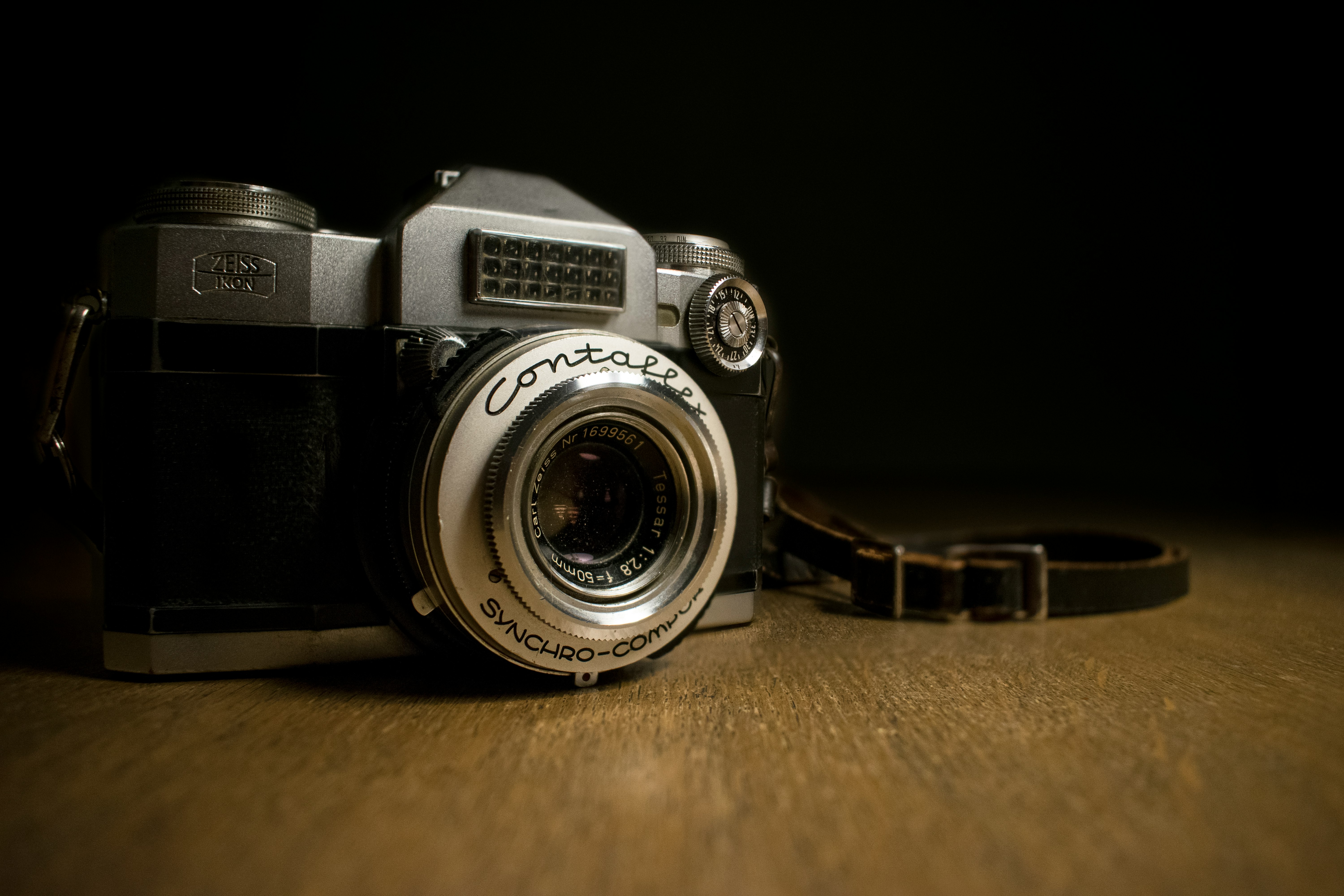 closeup photography of gray and black camera on table